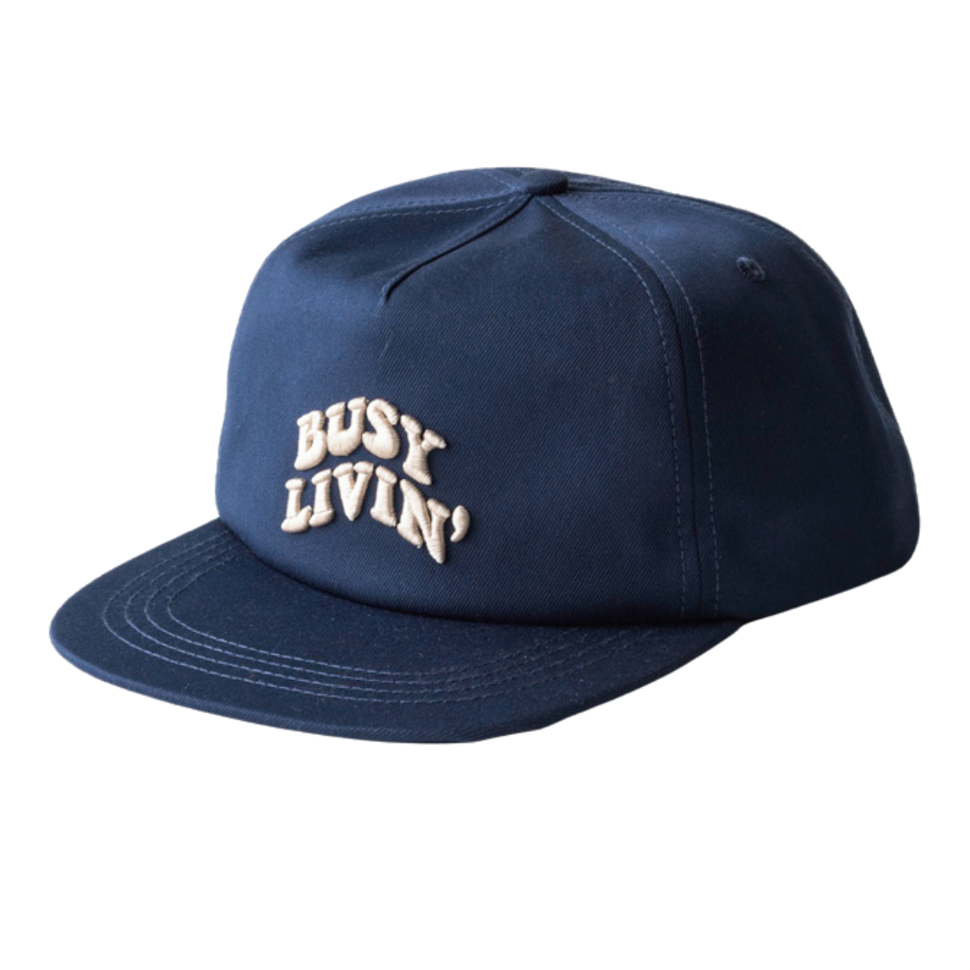 A Navy Kavu Ridgemont cap with embroidery on the front, featuring a structured design.